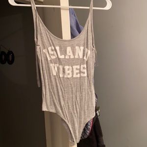 Light grey bodysuit with white lettering